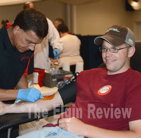 Craig Niewohner donates blood. E-R photo