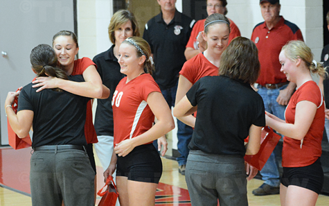 Seniors (l-r) Jill Schindler, Jenna Parks, Terri Seier and Nicole Beckman recognzied by the EPPJ Wolfpack coaches before Tuesday night's varsity game. Head coach is Tina Thiele-Blecher (l, back to camera), asst coach Emily Borer (c, background) and asst. coach Sandi Henn (r, back to camera). E-R photo
