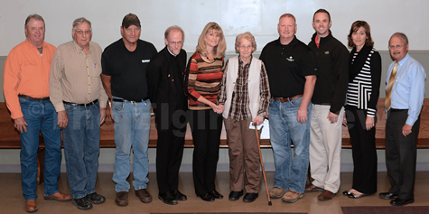 Recipients and trustee of the Tunink Estate. Pictured l-r: Jerry Heithoff, LeRoy Kerkman, Gary Hoefer, Fr. Ross Burkhalter, Sandy Kester, Yvonne Heithoff, Todd Heithoff, Michael Moser, Martha Nelson and Jack Green. E-R photo