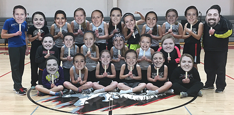 Wolfpack Girls Basketball Team with their big heads.