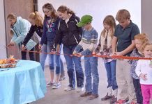 New Parish Hall Built “For The Kids” In Raeville Youth of the St. Bonaventure parish did the ceremonial ribbon-cutting. E-R photo