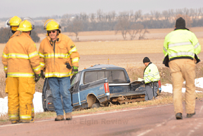 Antelope County Sheriff Bob Moore (with clipboard), the Nebraska State Patrol and members of Elgin Fire & Rescue were at the scene. E-R photo