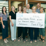 Bank supports ambulance fund drive BankofElgin check EMTs 1033 4 col cmyk