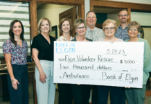 Bank supports ambulance fund drive BankofElgin check EMTs 1033 4 col cmyk