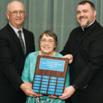 Mosers receive Roncalli Award Sunday night Ed Sandy Moser Fr. John Norman 4351 3 col cmyk